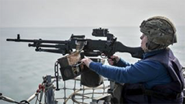Mayor firing gun on HMS St Albans
