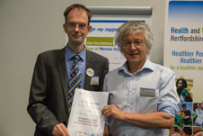 Cllr Rowlands holding the certificate after he was appointed as District Mental Health Champion