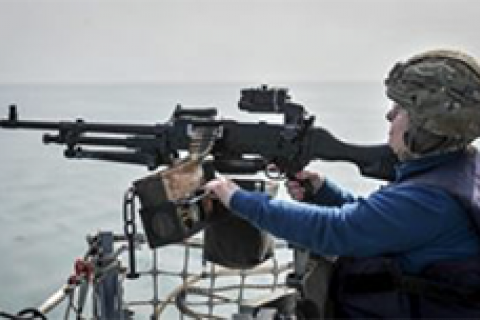 Mayor firing gun on HMS St Albans