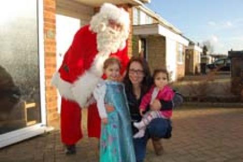 Santa visits families