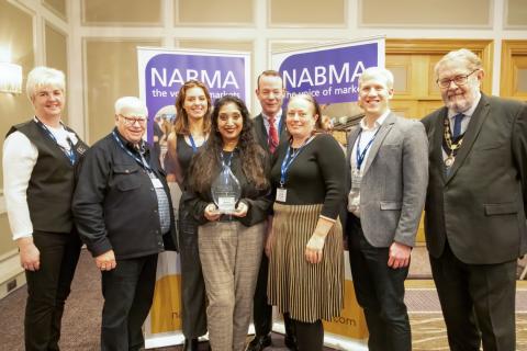 Cllr Jacqui Taylory, 3rd from right, and the Markets Team accept the award